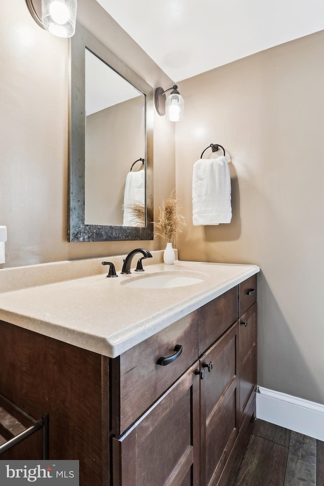 bathroom featuring vanity and wood finished floors