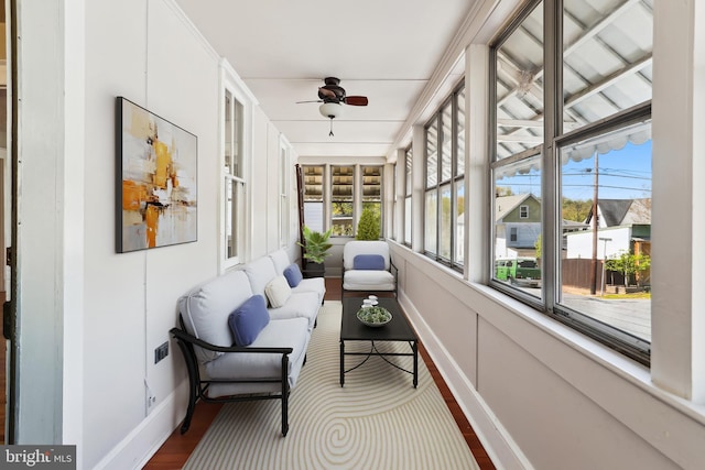 sunroom / solarium with ceiling fan and outdoor lounge area
