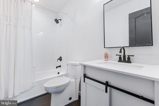 bathroom featuring shower / bath combo, vanity, toilet, and wood finished floors