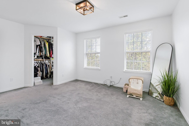 unfurnished bedroom with baseboards and carpet floors