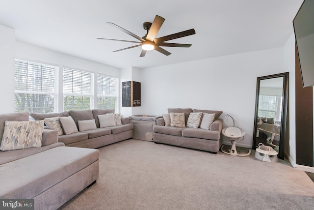 living room featuring ceiling fan and carpet flooring