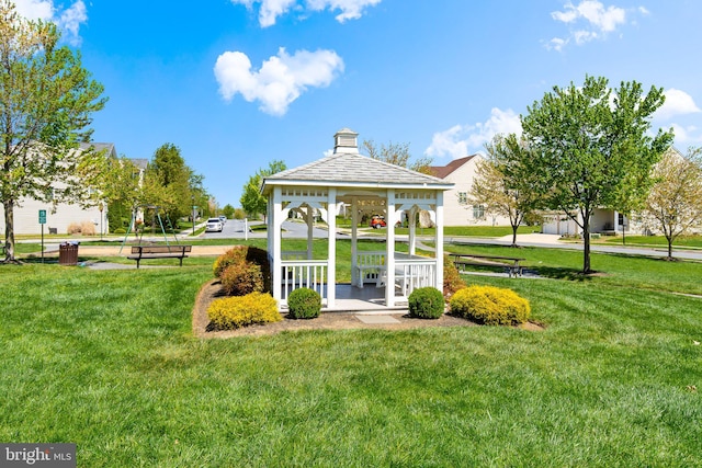 surrounding community with a lawn and a gazebo
