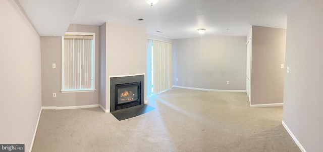 2208 Merion Pond Pond Unit 62, Woodstock, MD 21163 - unfurnished living room with a fireplace with flush hearth, baseboards, and carpet