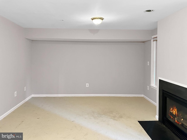 2208 Merion Pond Pond Unit 62, Woodstock, MD 21163 - below grade area with a fireplace with flush hearth, baseboards, and carpet flooring