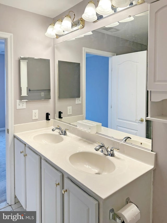 2208 Merion Pond Pond Unit 62, Woodstock, MD 21163 - bathroom featuring a sink, tile patterned flooring, and double vanity