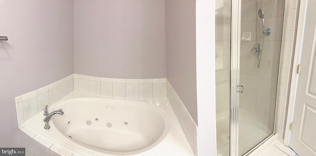 2208 Merion Pond Pond Unit 62, Woodstock, MD 21163 - bathroom featuring a whirlpool tub and a stall shower