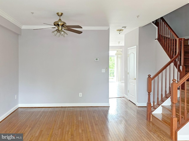 2208 Merion Pond Pond Unit 62, Woodstock, MD 21163 - unfurnished living room featuring baseboards, ornamental molding, ceiling fan, and hardwood / wood-style floors