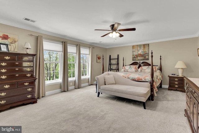 bedroom with ceiling fan, visible vents, baseboards, ornamental molding, and light carpet