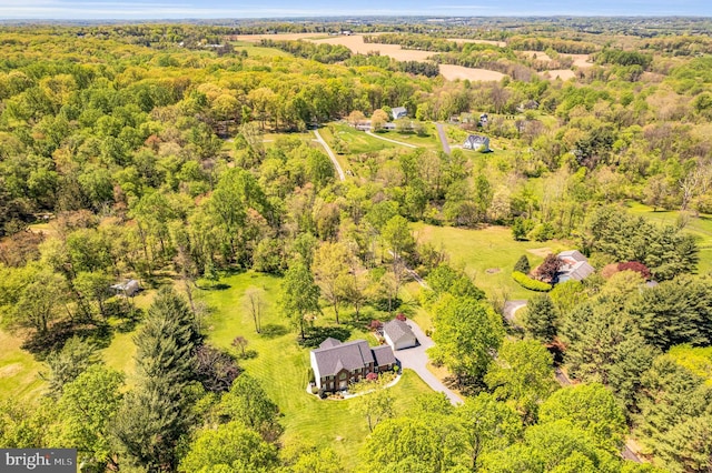 drone / aerial view with a view of trees
