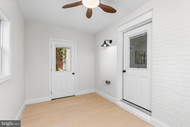 3500 The Alameda, Baltimore, MD 21218 - entryway with light wood-style floors, a ceiling fan, baseboards, and brick wall