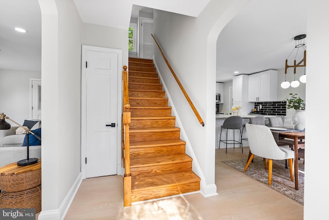3500 The Alameda, Baltimore, MD 21218 - stairway featuring arched walkways, wood finished floors, baseboards, and recessed lighting