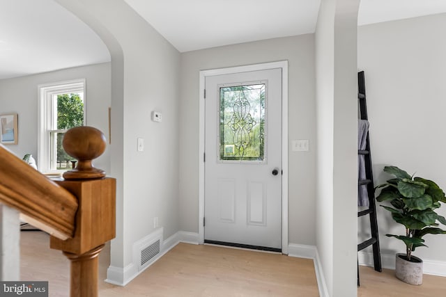 3500 The Alameda, Baltimore, MD 21218 - entrance foyer with arched walkways, light wood-style floors, and baseboards