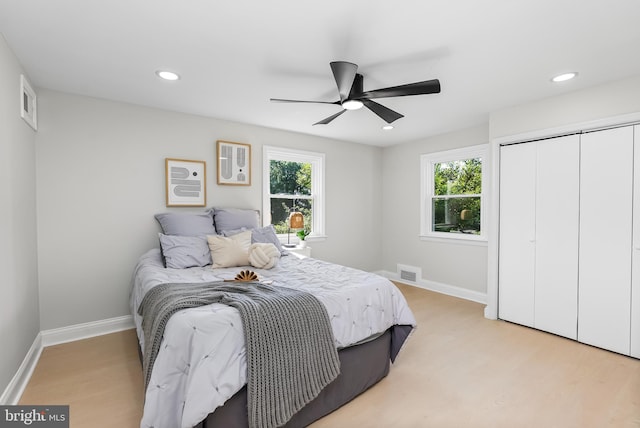 3500 The Alameda, Baltimore, MD 21218 - bedroom with multiple windows, light wood-style flooring, baseboards, recessed lighting, and a closet