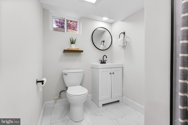 3500 The Alameda, Baltimore, MD 21218 - bathroom with marble finish flooring, toilet, vanity, and baseboards