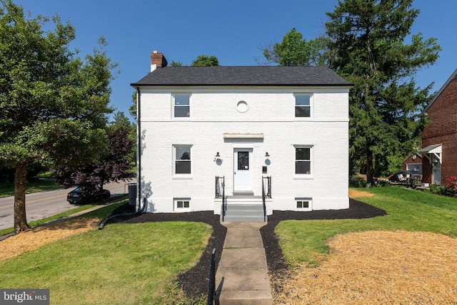 3500 The Alameda, Baltimore, MD 21218 - view of front facade with brick siding, a chimney, and a front yard
