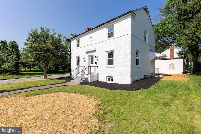 3500 The Alameda, Baltimore, MD 21218 - view of front of property featuring brick siding, a front lawn, and a chimney