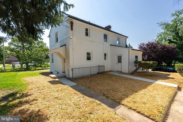 3500 The Alameda, Baltimore, MD 21218 - view of front of property featuring brick siding and a front lawn