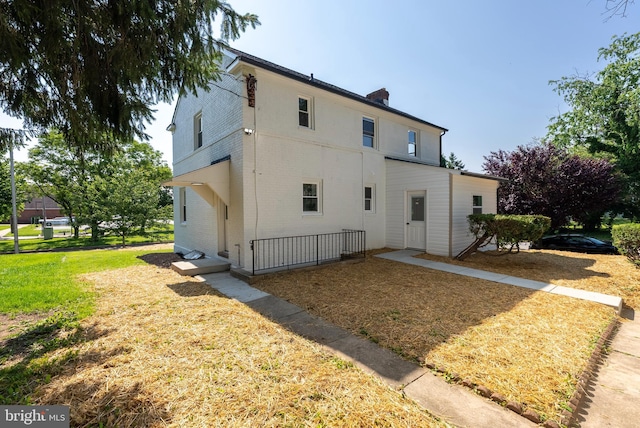 3500 The Alameda, Baltimore, MD 21218 - view of front of property featuring brick siding and a front lawn