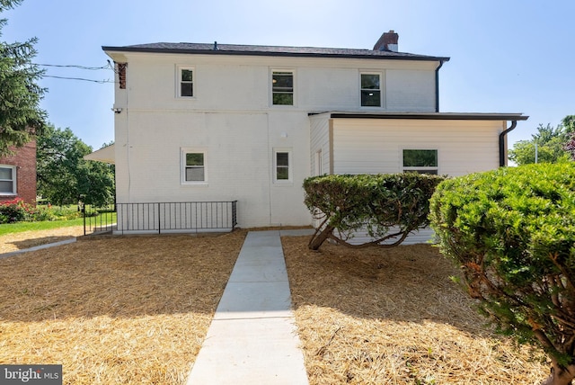 3500 The Alameda, Baltimore, MD 21218 - view of home's exterior with a chimney and brick siding