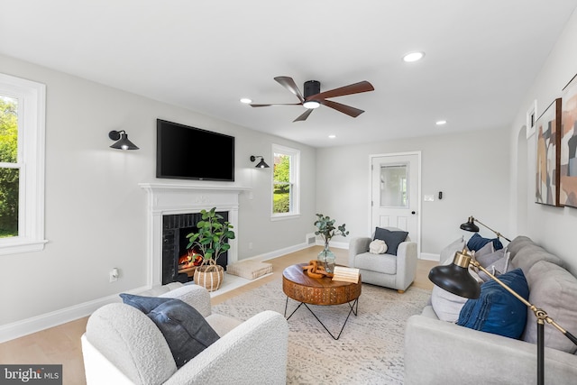 3500 The Alameda, Baltimore, MD 21218 - living area with a lit fireplace, ceiling fan, recessed lighting, wood finished floors, and baseboards