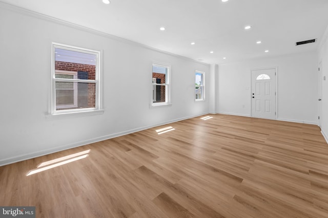 foyer featuring recessed lighting, baseboards, and light wood finished floors