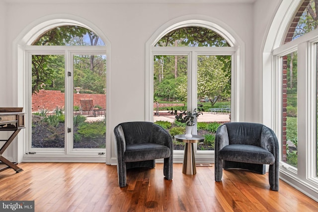living area with hardwood / wood-style floors