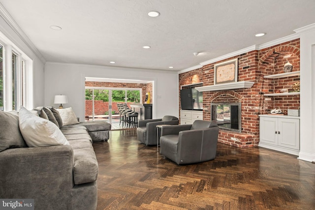 living room featuring crown molding, a brick fireplace, and recessed lighting