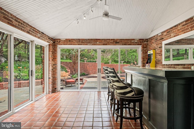 sunroom with a ceiling fan and outdoor dry bar
