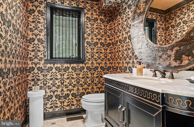 half bath featuring wallpapered walls