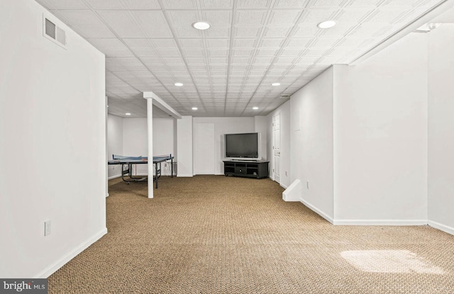 basement with baseboards, carpet flooring, recessed lighting, and visible vents