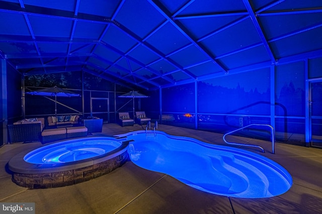 view of pool featuring a patio and a pool with connected hot tub