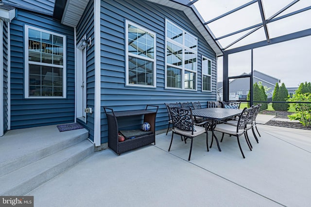 view of patio / terrace with glass enclosure and outdoor dining space