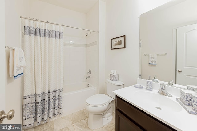 bathroom featuring vanity, toilet, and shower / bath combo with shower curtain
