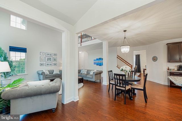 dining area featuring baseboards, stairs, dark wood finished floors, and plenty of natural light