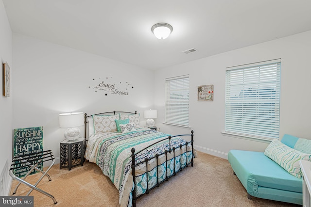 bedroom featuring carpet flooring, baseboards, and visible vents