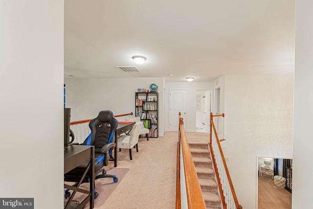 home office with light colored carpet and visible vents