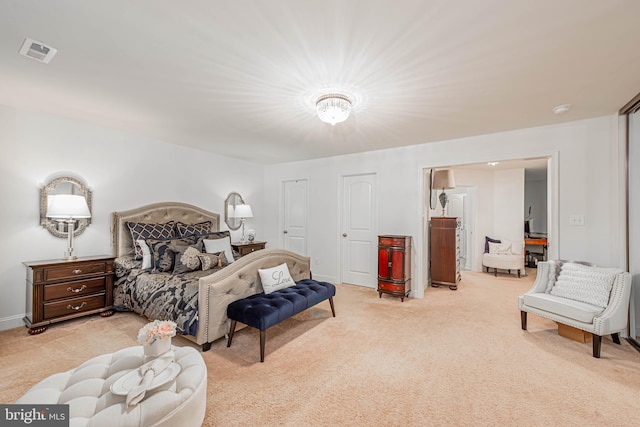bedroom with carpet flooring and visible vents