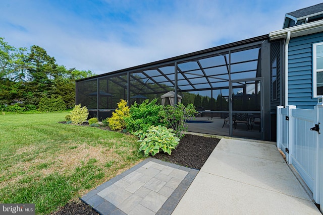 view of yard with a patio and a lanai