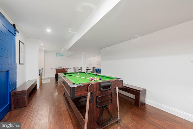 recreation room featuring pool table, a barn door, recessed lighting, dark wood finished floors, and baseboards
