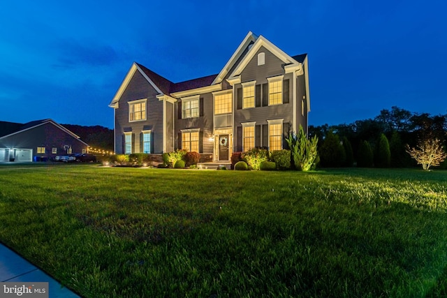 view of front of home with a yard
