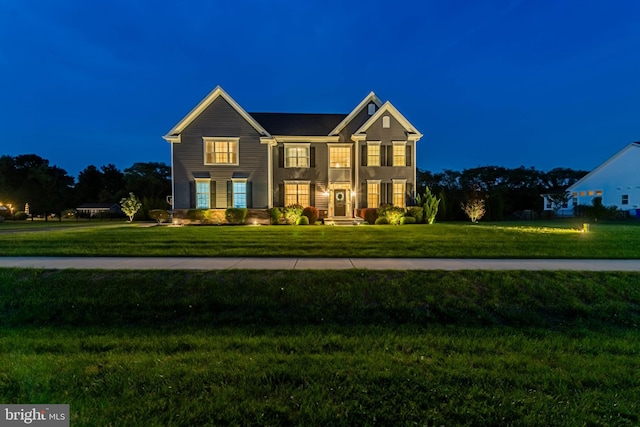 view of front of property with a yard