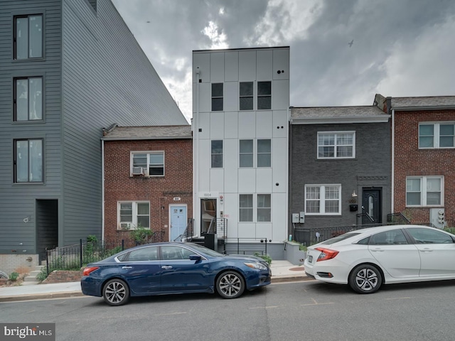 townhome / multi-family property featuring brick siding