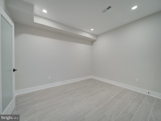 below grade area featuring baseboards and recessed lighting