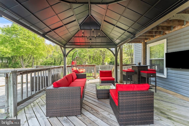 wooden deck featuring outdoor lounge area and a gazebo