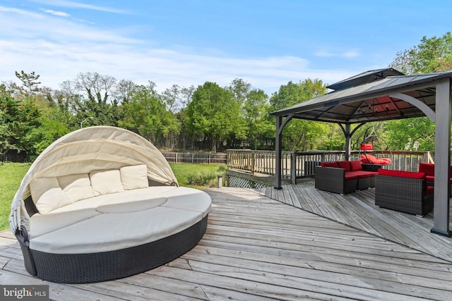 wooden deck with outdoor lounge area and a gazebo