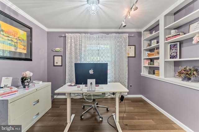 office space featuring track lighting, crown molding, dark wood finished floors, and baseboards