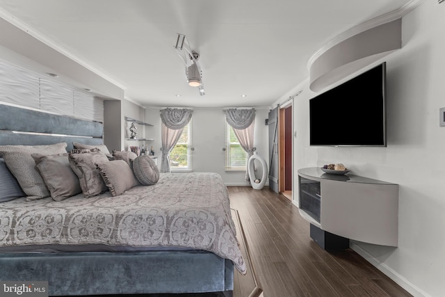 bedroom with baseboards, recessed lighting, ornamental molding, and dark wood-style floors