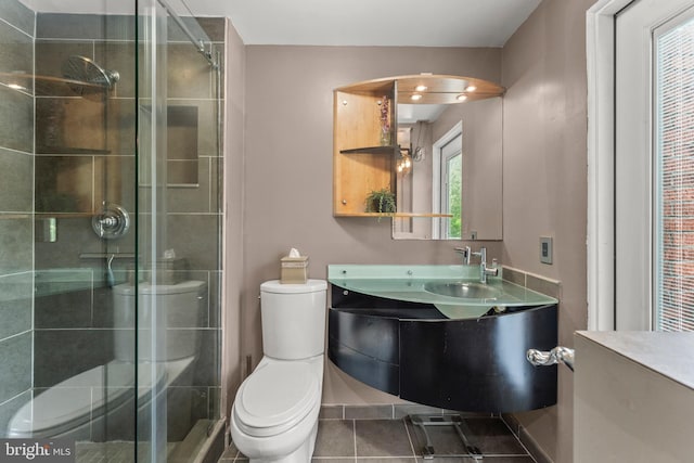 bathroom with toilet, a stall shower, tile patterned flooring, and vanity