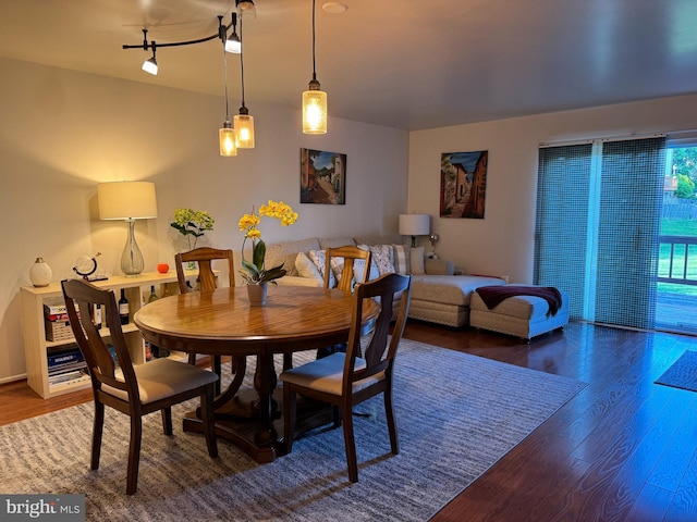 dining area with wood finished floors