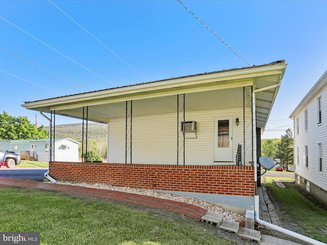 view of front facade featuring a porch and brick siding